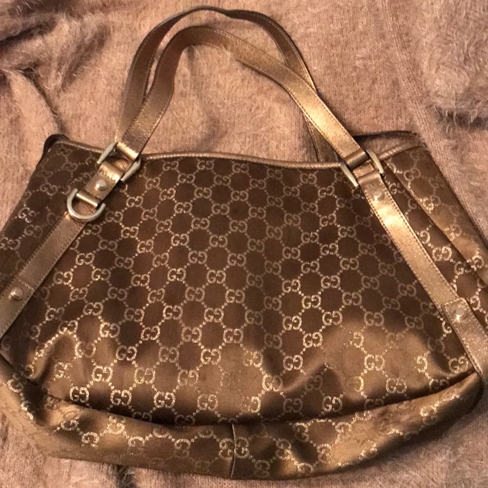 Authentic Gucci bronze satin purse
